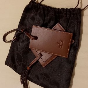 GUCCI luggages tags holders.